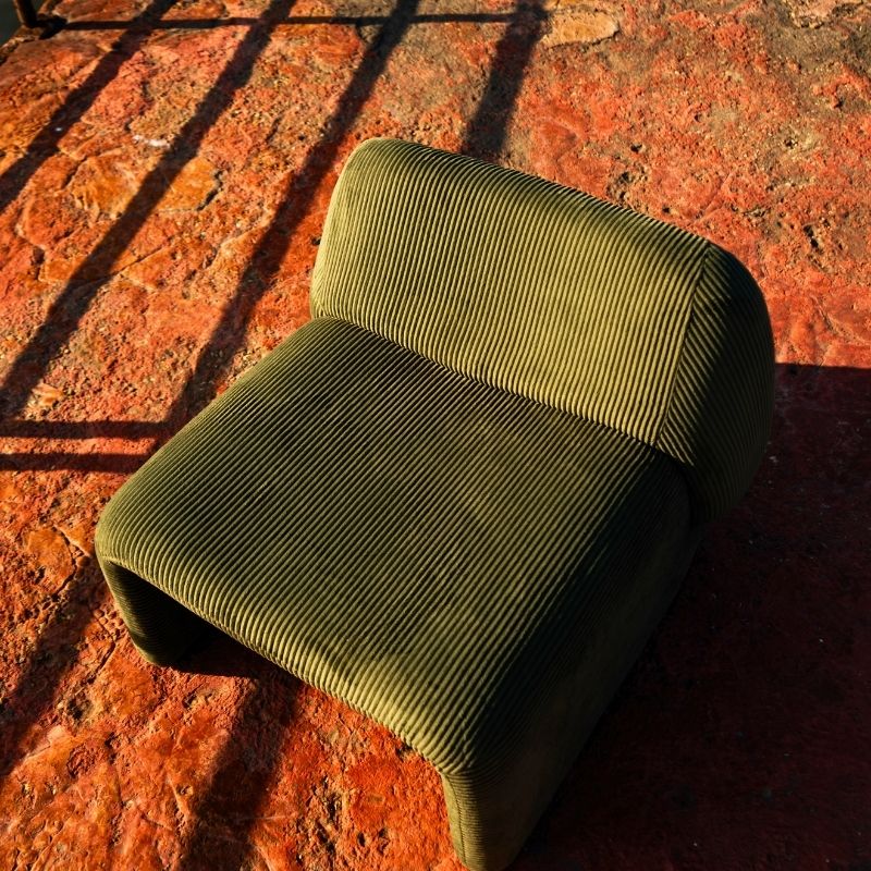 Olive green corduroy modular armchair with ribbed fabric texture on a terrace overlooking the sea Mahogni