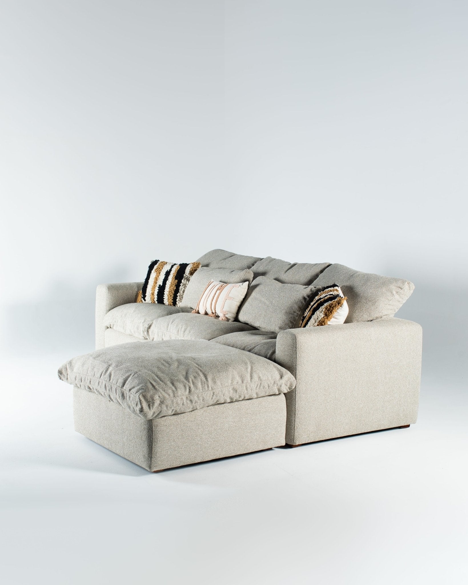 Squish Couch - Modern grey-beige sectional sofa with accent pillows by Mahogni.
