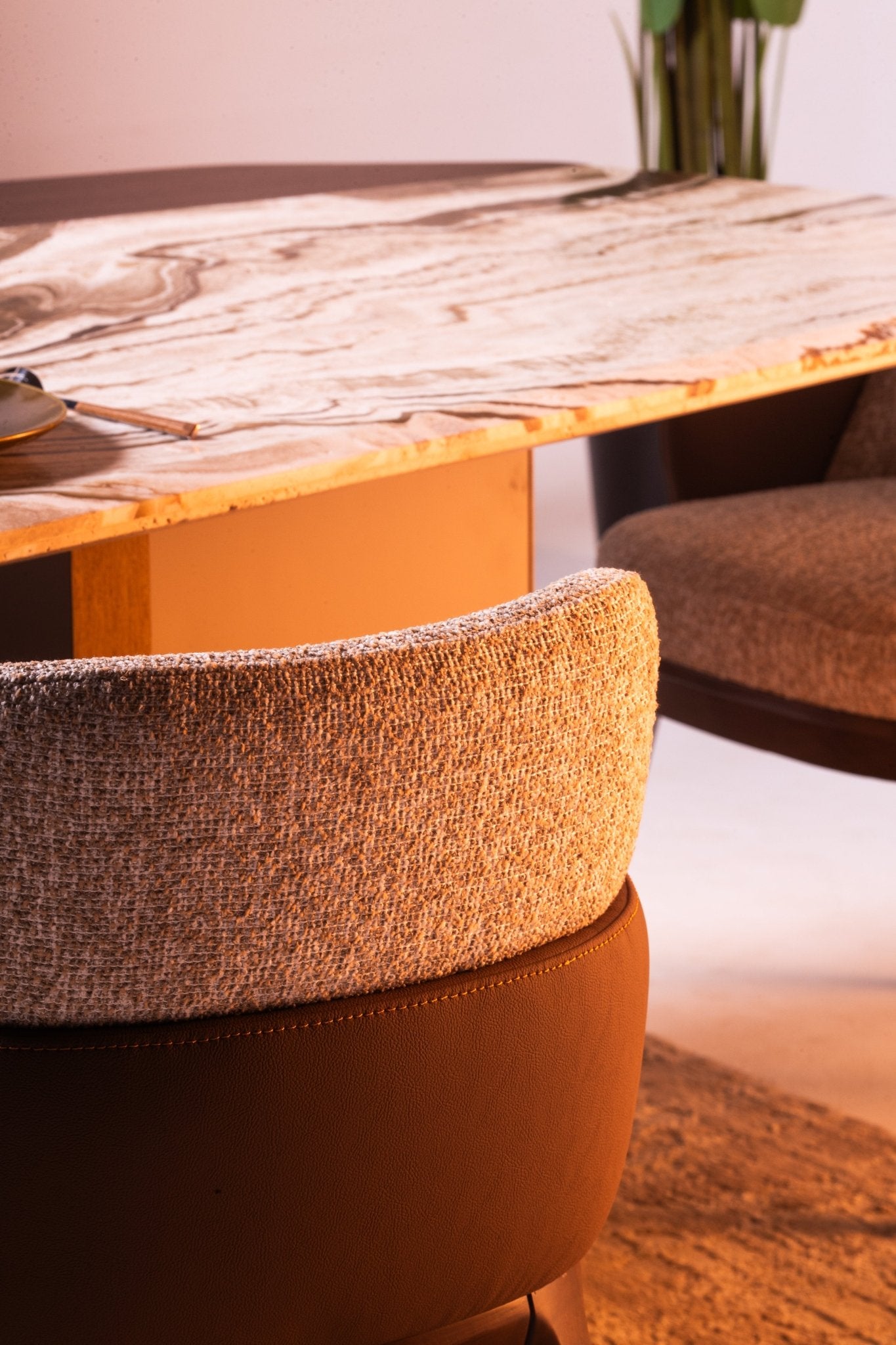 Modern Light Dining Room set with oval marble table, sculptural pedestal bases, and textured chairs by Mahogni.