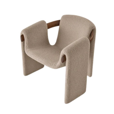 Modern sculptural fabric armchair with minimalist wooden frame design for contemporary living rooms.