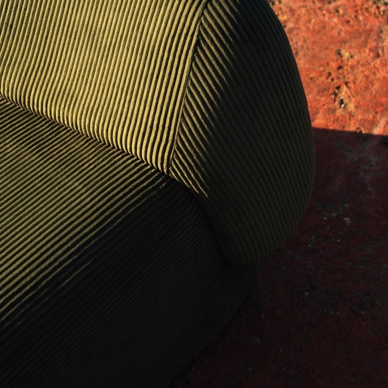 Olive green corduroy modular armchair with ribbed fabric texture on a terrace overlooking the sea Mahogni