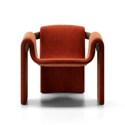 Modern sculptural fabric armchair with minimalist wooden frame design for contemporary living rooms.