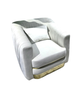 Luxury off white pleated velvet accent chair with wide gold metal base and plush pillow by Mahogni.
