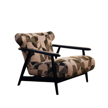 Complete modular living room sofa set in pebble grey with charcoal geometric pillows on a sandy backdrop at sunset. Mahogni 