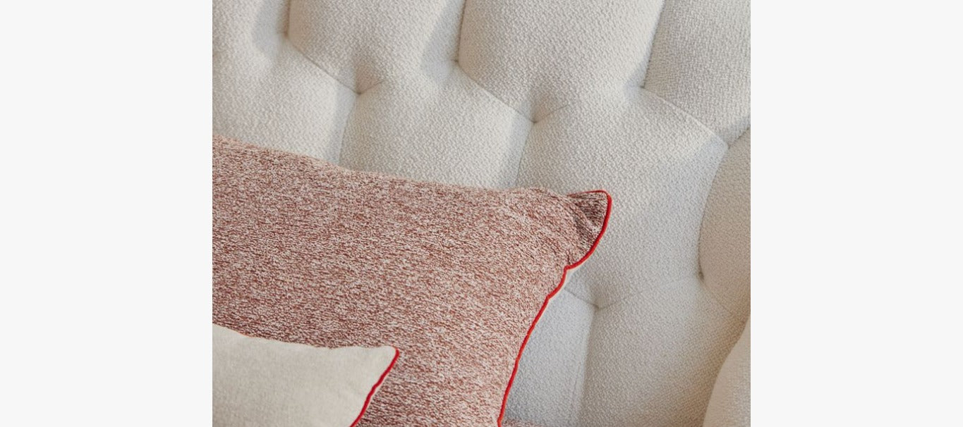 Close-up Details of Luna Bed Quilted Bouclé Headboard and Warm Pillows