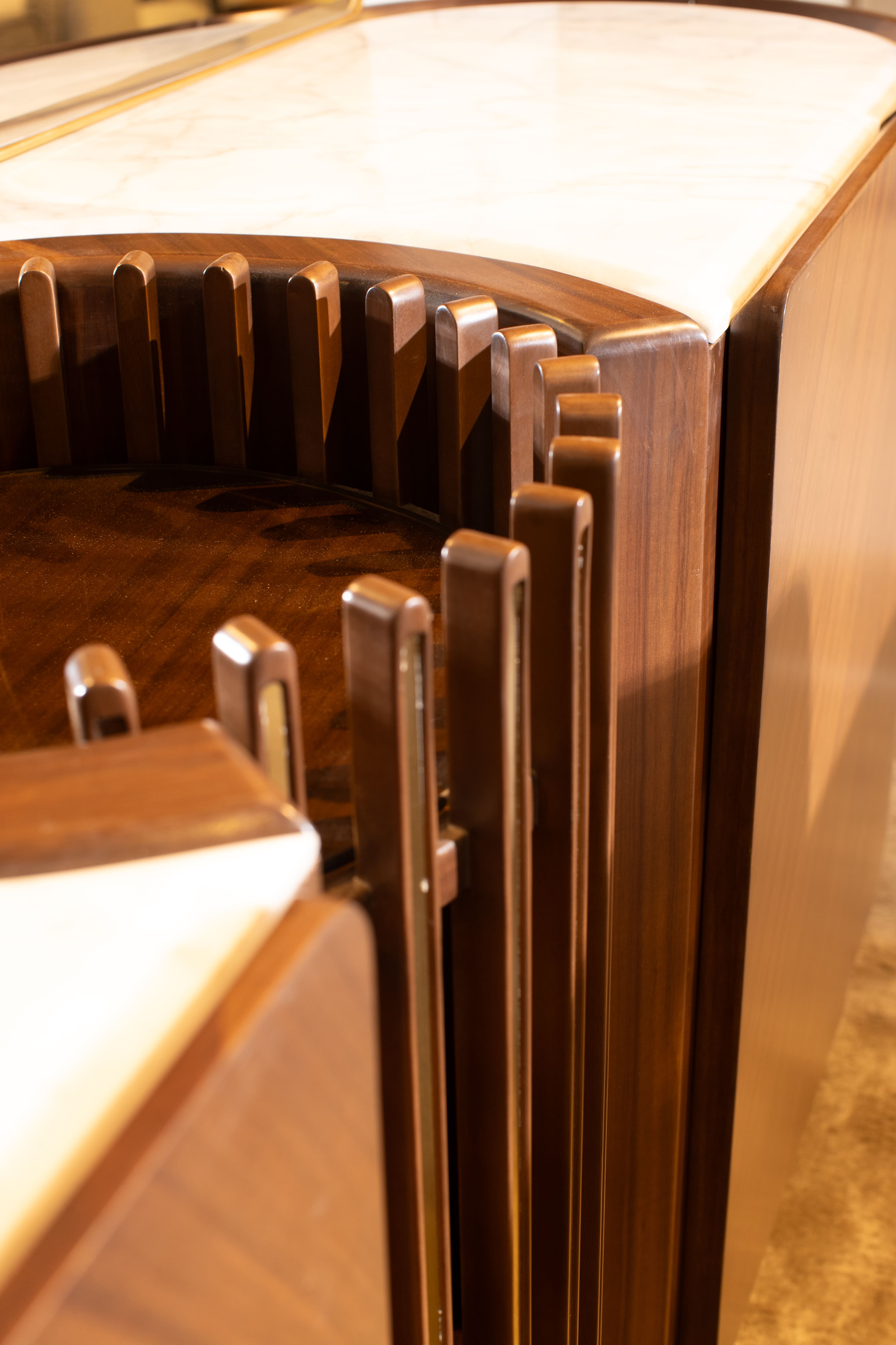 Close-up of a wooden gear mechanism with a detailed design.