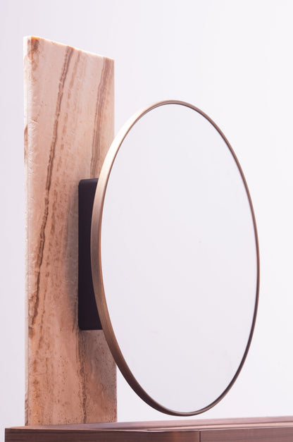 High-end luxury bedroom set featuring a tall upholstered bed with vertical tufting, dark wood nightstands, and a modern vanity by Mahogni.